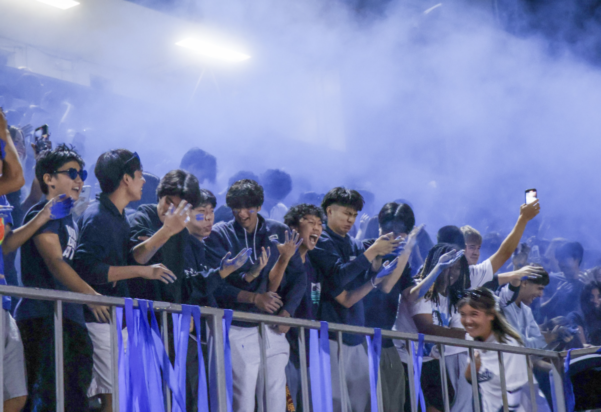 HOMECOMING HAZE: Northwood’s student section rallies behind their team with blue chalk, fueling the Homecoming spirit.